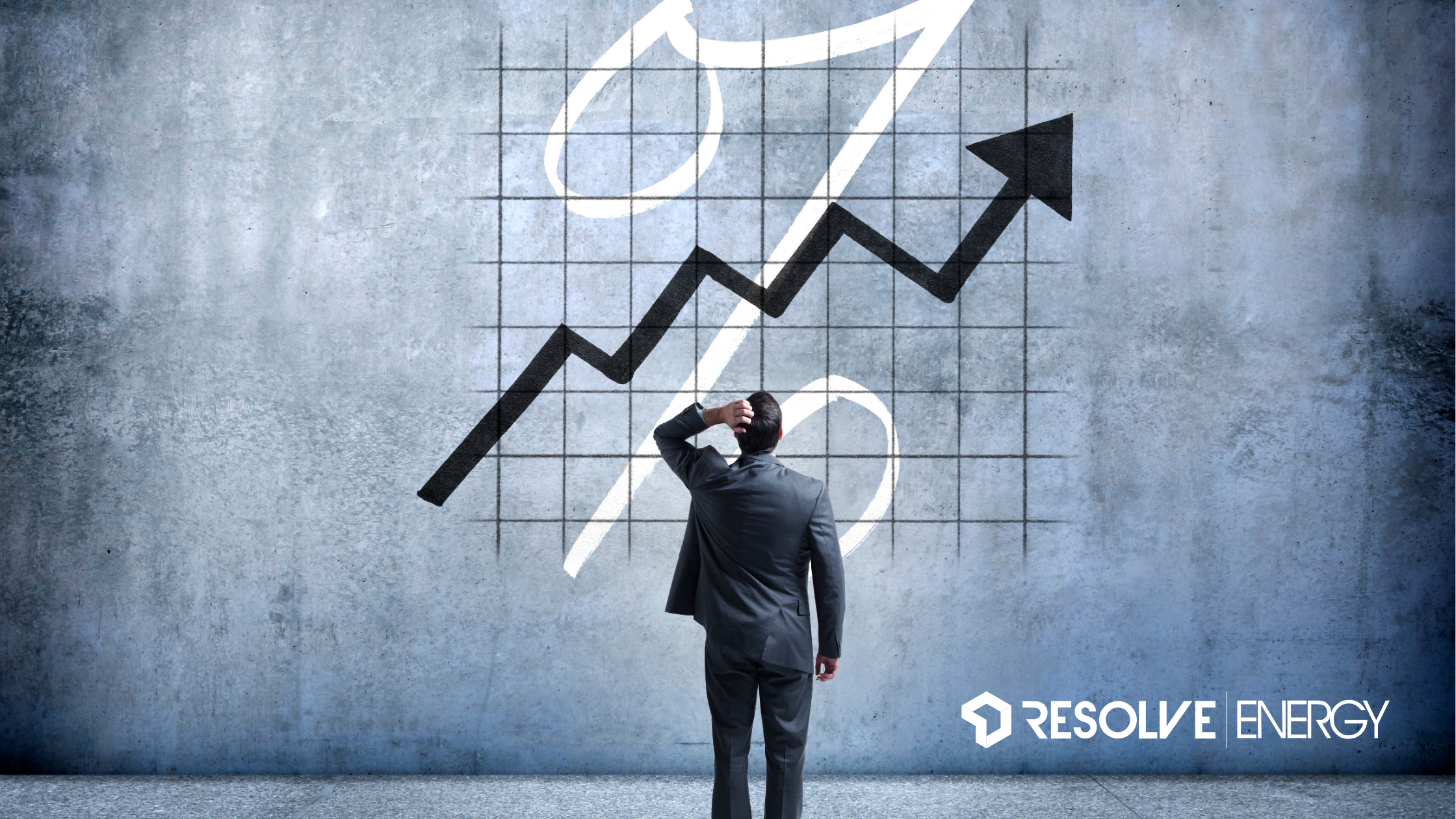 alt="Business owner looking at rising energy prices represented by a chart with upward arrow"
